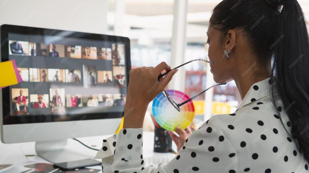 Female graphic designer working computer desk office 13339