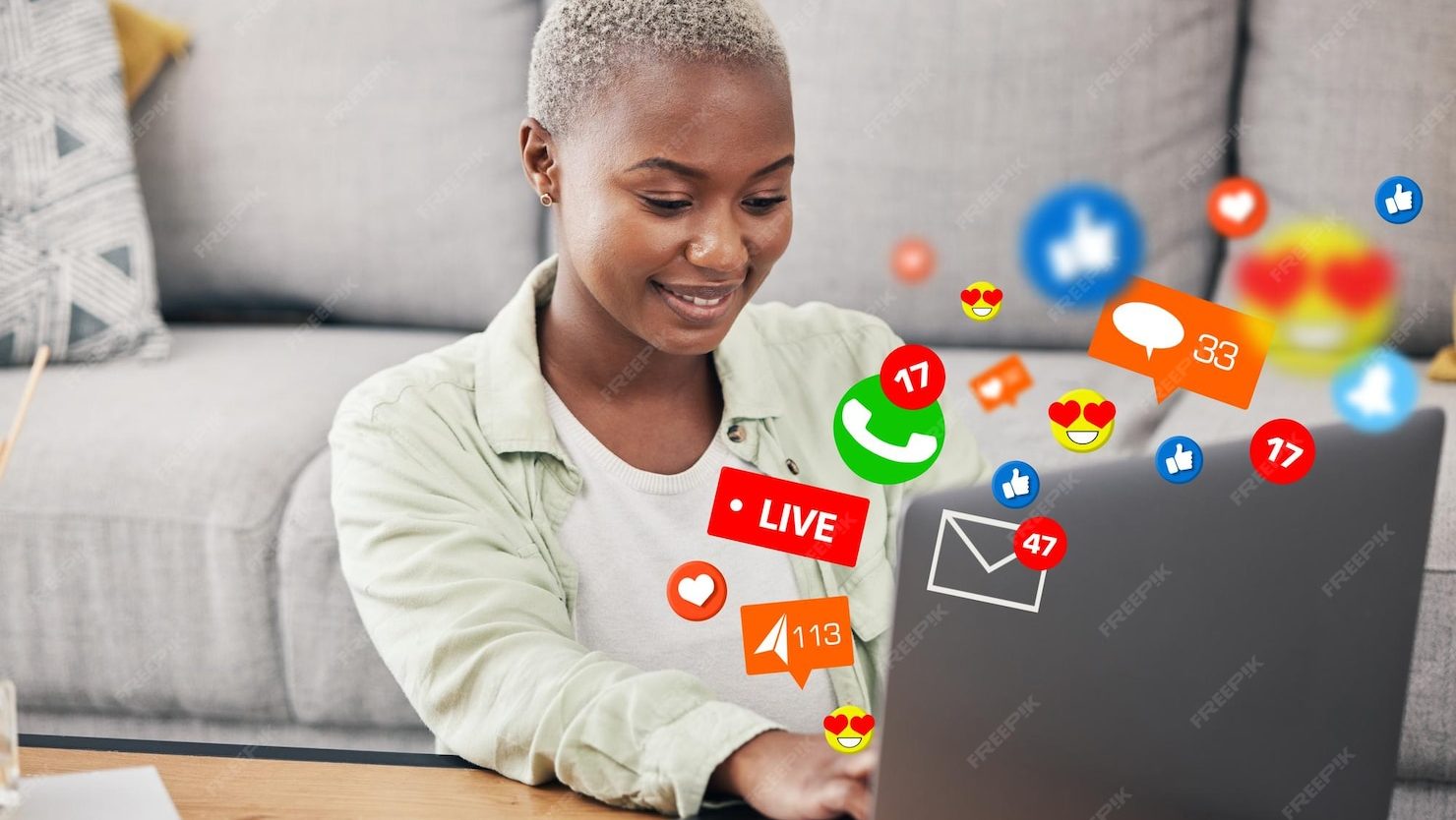 Woman laptop social media message icon home floor connection content platform african influencer computer communication live streaming like love emoji reaction overlay 590464